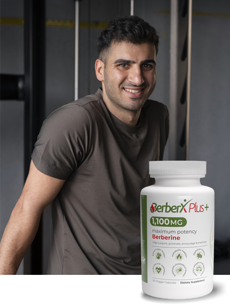 Young, slim man smiling beside a bottle of BerberX Plus.